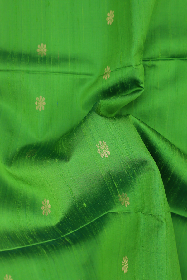 Raw Silk Saree In Parrot Green With Floral Buttas
