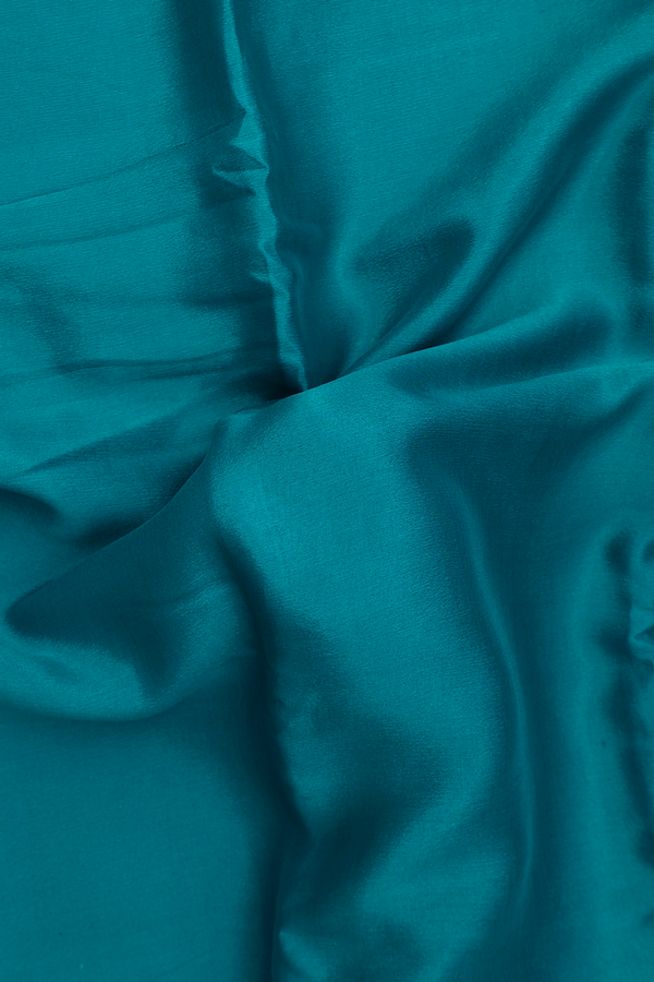 Chiffon Saree In Plain Peacock Blue With Zari Border