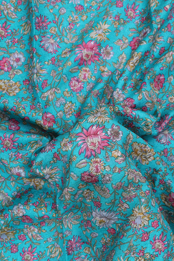 Printed Silk Saree In Turquoise Blue With Floral Design