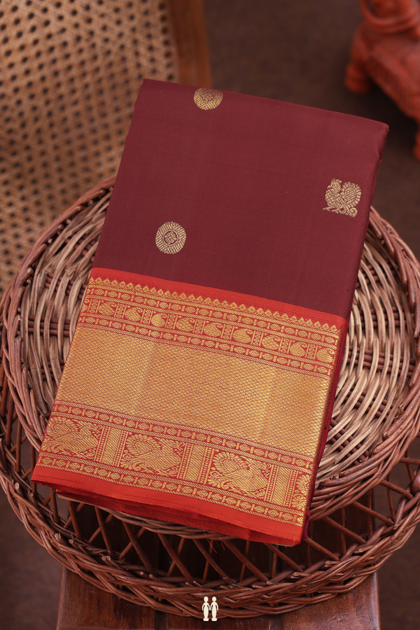 kanchipuram Silk Saree In Maroon With Peacock Buttas