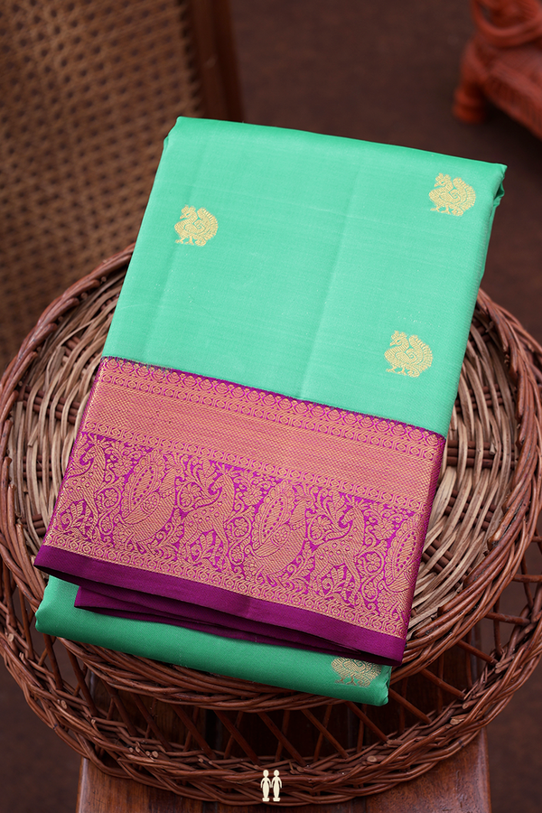 Kanchipuram Silk Saree In Green With Peacock Buttas