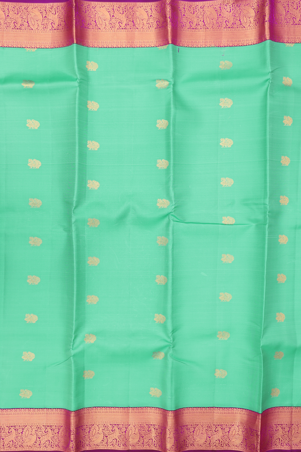 Kanchipuram Silk Saree In Green With Peacock Buttas