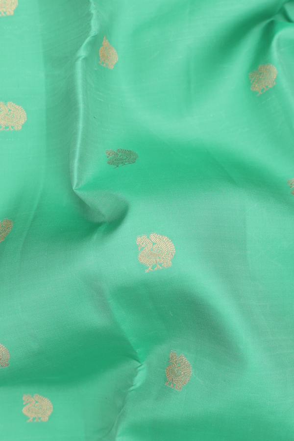 Kanchipuram Silk Saree In Green With Peacock Buttas