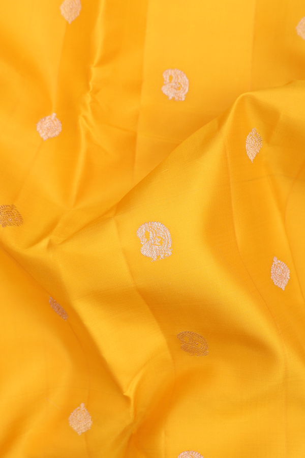 Kanchipuram Silk Saree In Saffron Yellow With Paisley Buttas