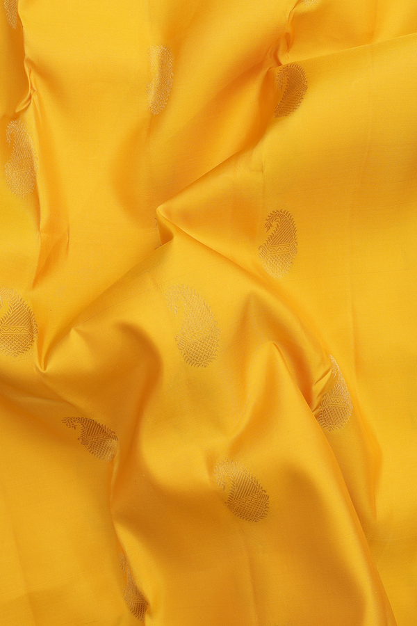 Kanchipuram Silk Saree In Saffron Yellow With Paisley Buttas