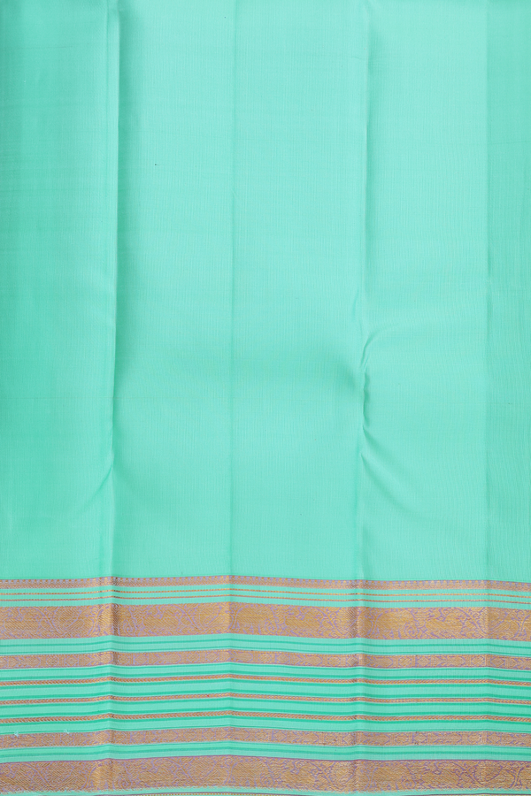 Kanchipuram Silk Saree In Pastel Sea Green With Floral Buttis