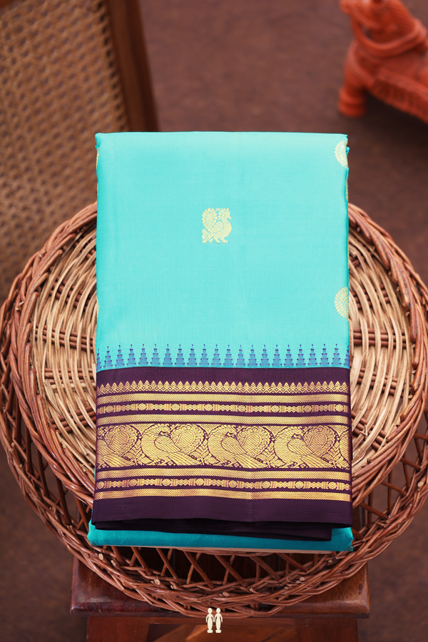 Kanchipuram Silk Saree In Turquoise Blue With Peacock Buttas