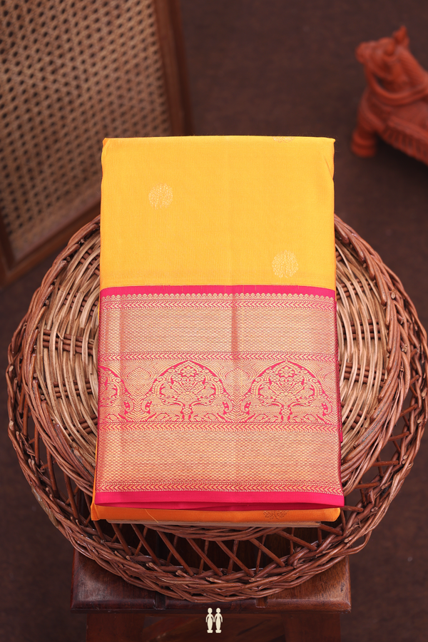 Kanchipuram Silk Saree In Saffron Yellow With Floral Buttas