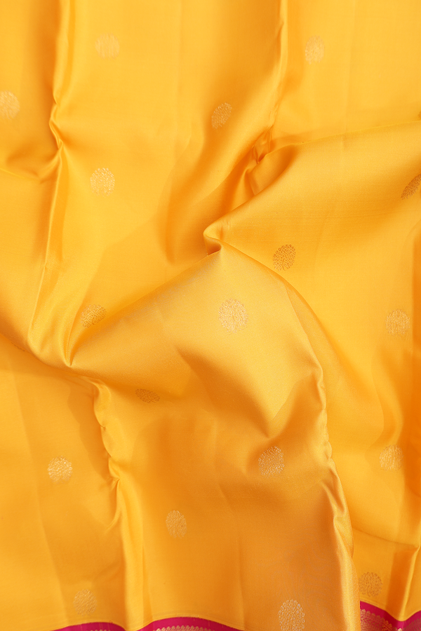 Kanchipuram Silk Saree In Saffron Yellow With Floral Buttas