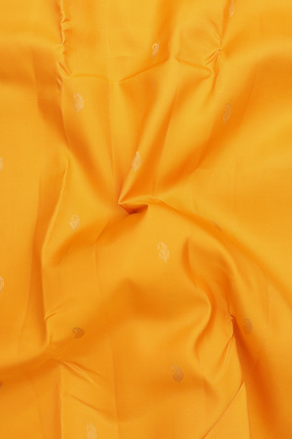 Kanchipuram Silk Saree In Saffron Yellow With Paisley Buttas