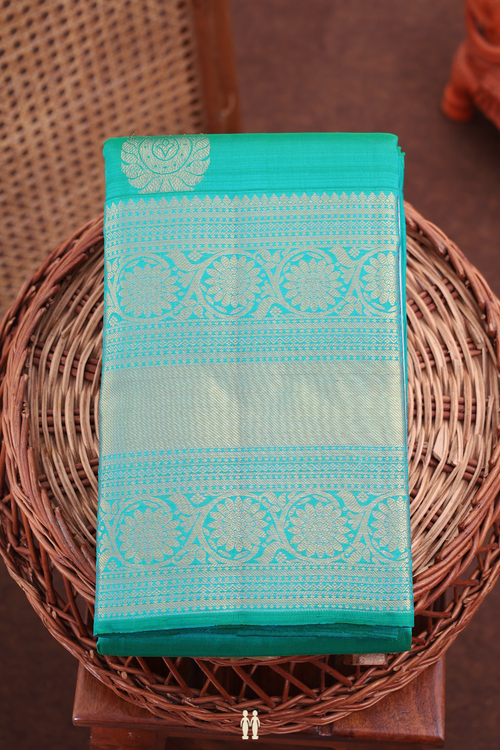 Kanchipuram Silk Saree In Peacock Blue With Zari Buttas