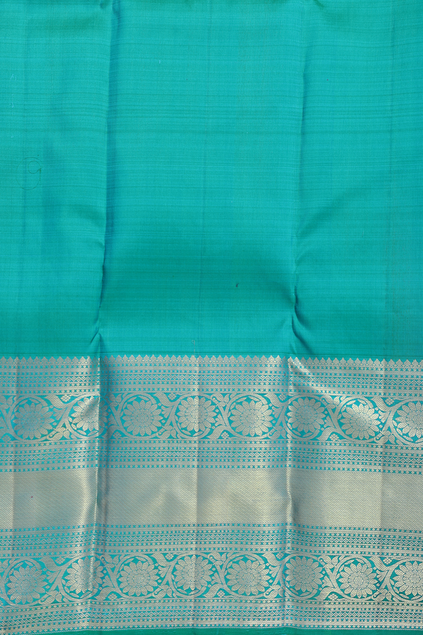 Kanchipuram Silk Saree In Peacock Blue With Zari Buttas