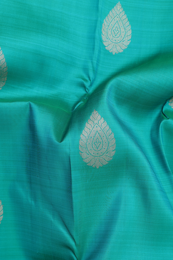 Kanchipuram Silk Saree In Peacock Blue With Zari Buttas