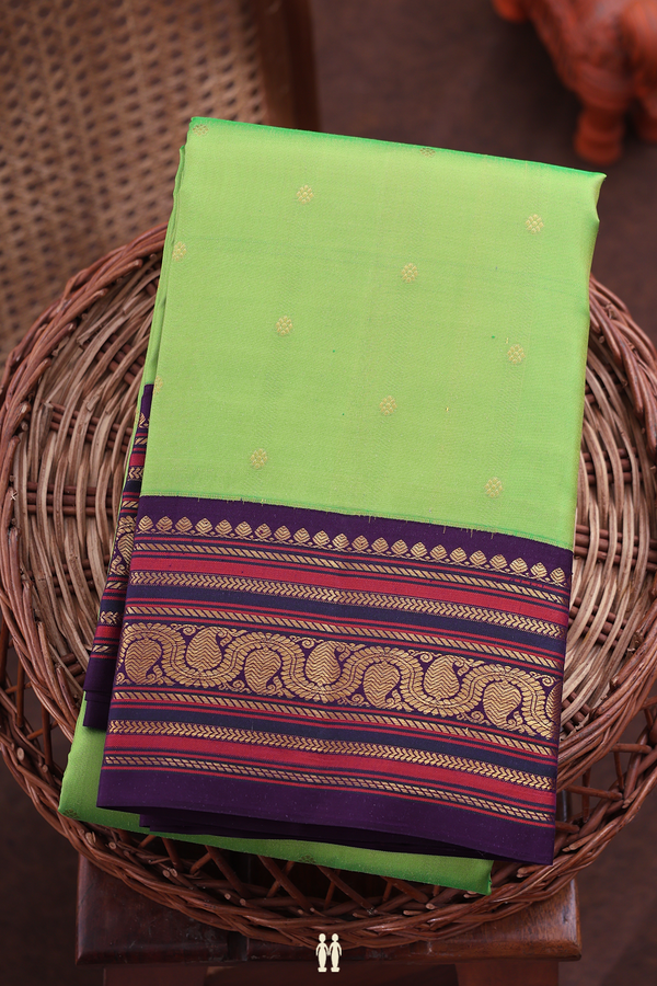 Kanchipuram Silk Saree In Parrot Green With Floral Buttis