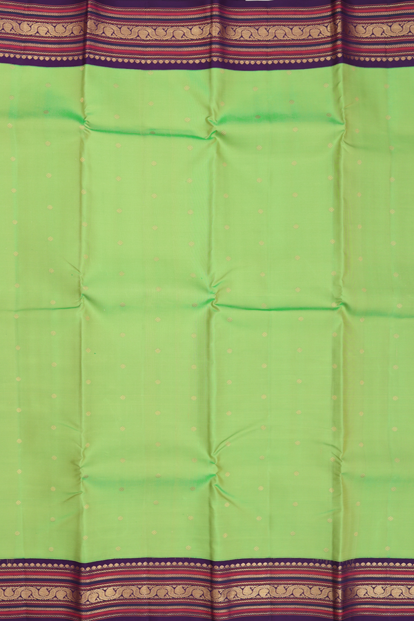 Kanchipuram Silk Saree In Parrot Green With Floral Buttis