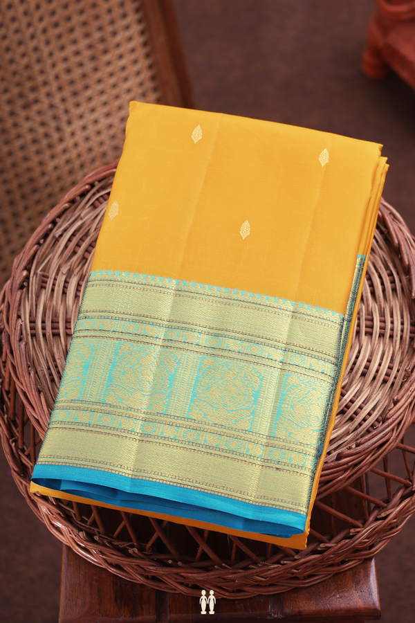 Kanchipuram Silk Saree In Saffron Yellow With Zari Buttas
