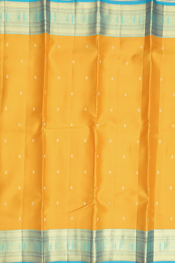 Kanchipuram Silk Saree In Saffron Yellow With Zari Buttas