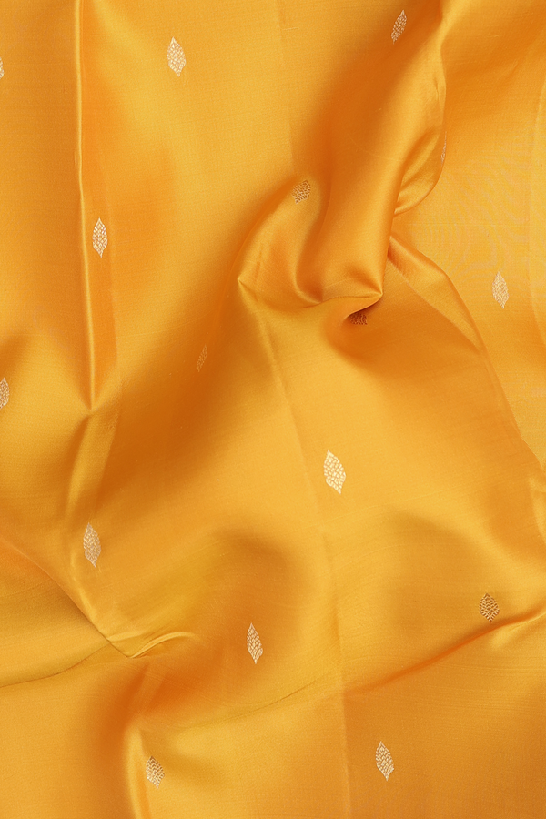 Kanchipuram Silk Saree In Saffron Yellow With Zari Buttas