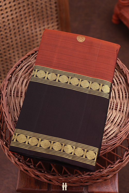 Kanchipuram Silk Saree In Rust Orange With Chakram Buttas
