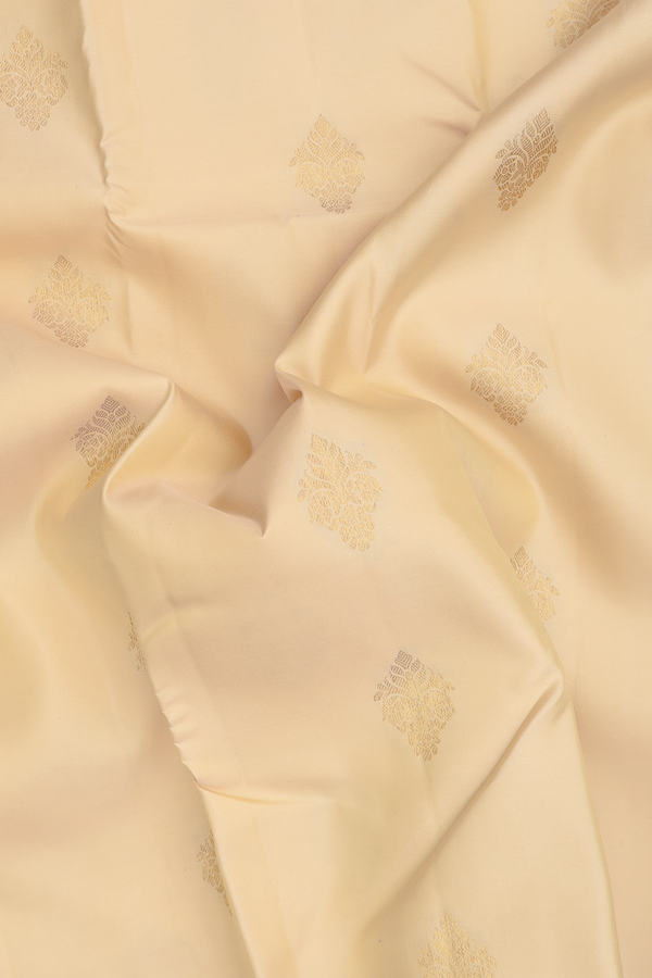 Kanchipuram Silk Saree In Cream Color With Zari Buttas