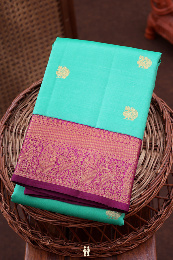 Kanchipuram Silk Saree In Green With Peacock Buttas