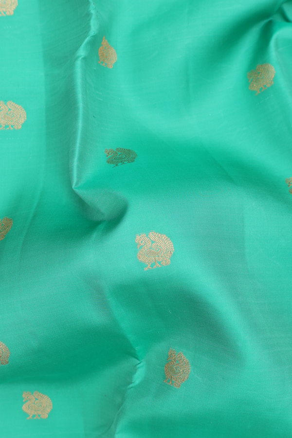 Kanchipuram Silk Saree In Green With Peacock Buttas