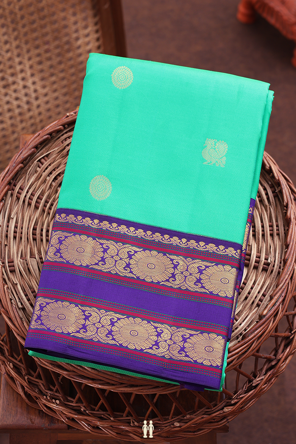 Kanchipuram Silk Saree In Green With Peacock Buttas