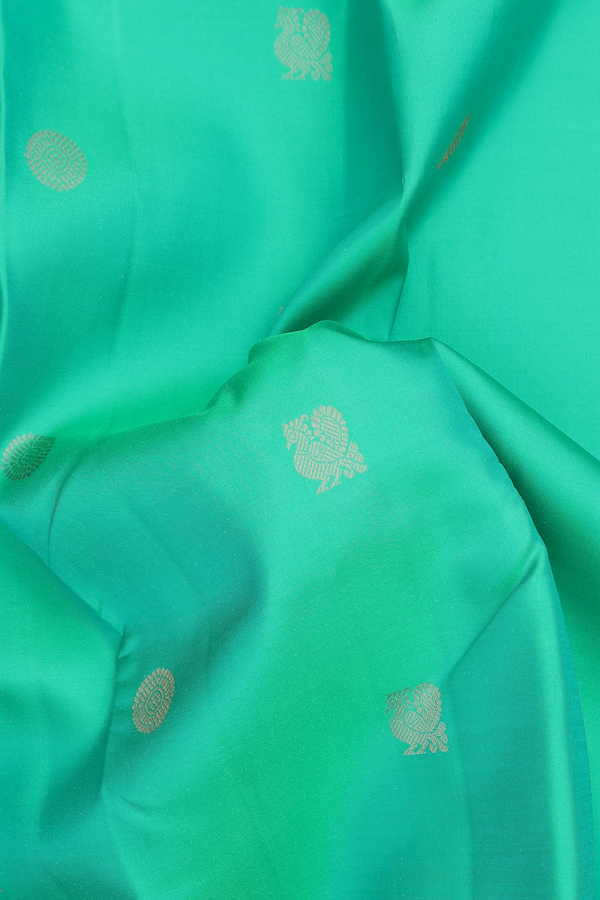 Kanchipuram Silk Saree In Green With Peacock Buttas