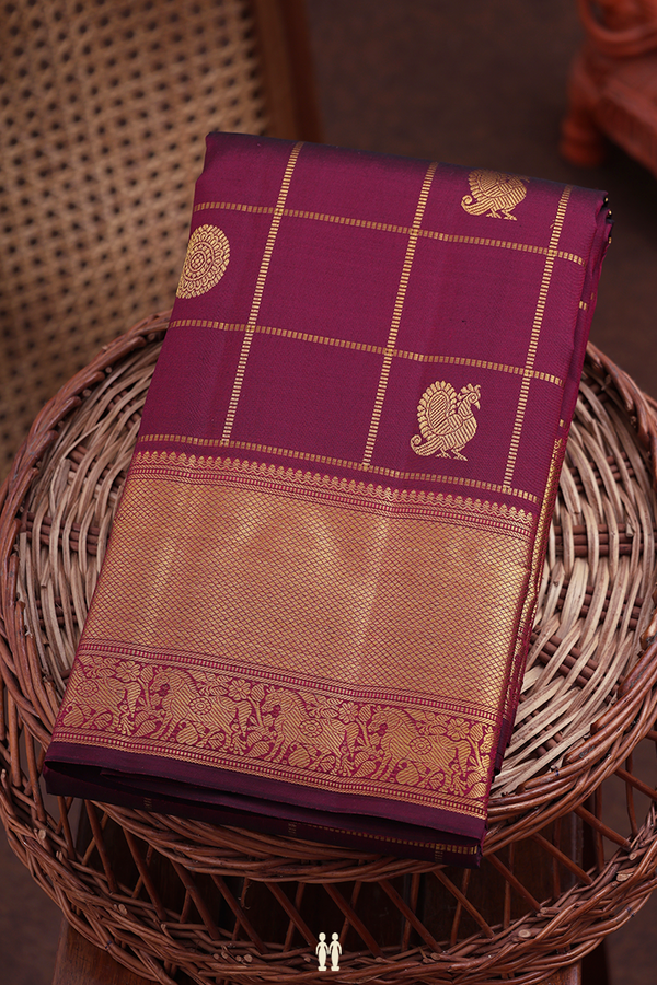 Kanchipuram Silk Saree In Maroon Along Checks With Buttas