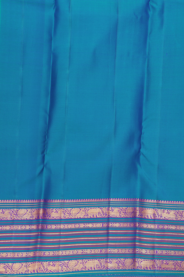 Kanchipuram Silk Saree In Capri Blue With Floral Buttas