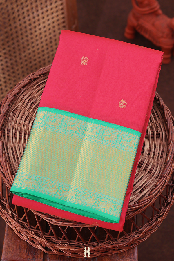 Kanchipuram Silk Saree In Rani Pink With Peacock Buttas