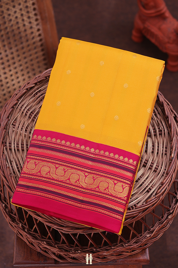 Kanchipuram Silk Saree In Saffron Yellow With Floral Buttis