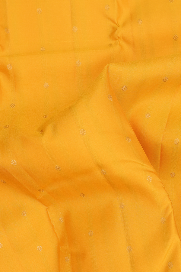 Kanchipuram Silk Saree In Saffron Yellow With Floral Buttis
