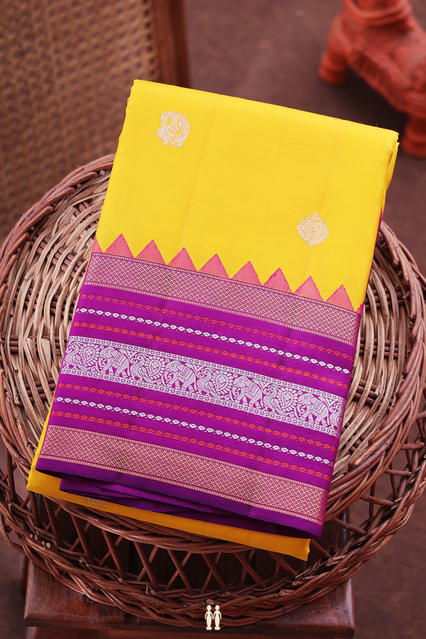 Kanchipuram Silk Saree In Saffron Yellow With Paisley Buttas