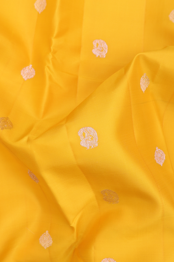 Kanchipuram Silk Saree In Saffron Yellow With Paisley Buttas