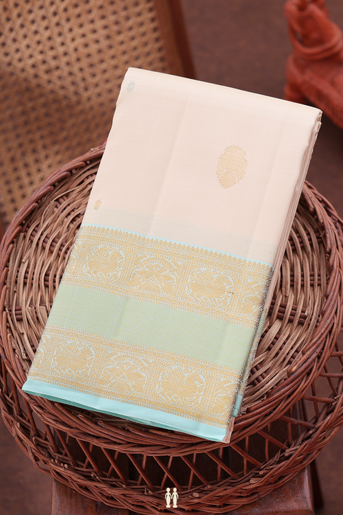 Kanchipuram Silk Saree In Cream Color Iruthalai Pakshi Buttas