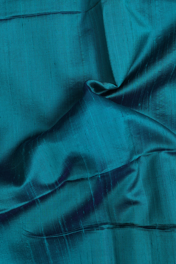 Raw Silk Saree In Plain Green With Zari Border