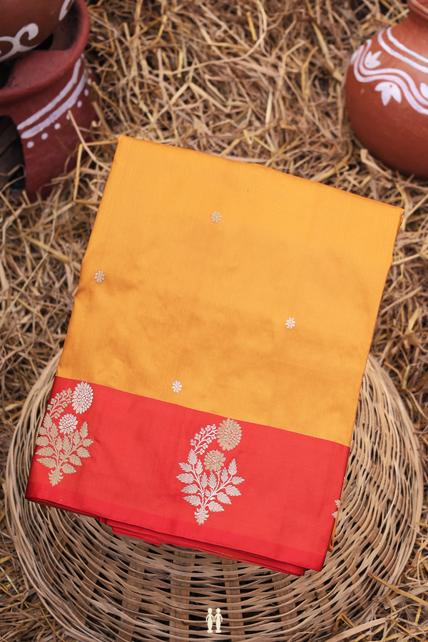Banarasi Silk Saree In Ochre Orange With Floral Buttas
