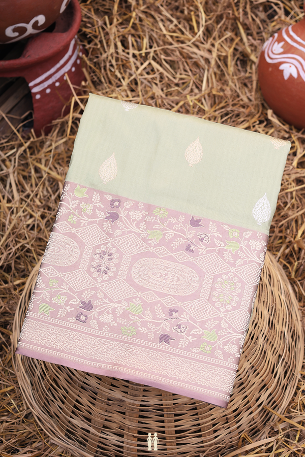 Banarasi Silk Saree In Pastel Green With Zari Buttas