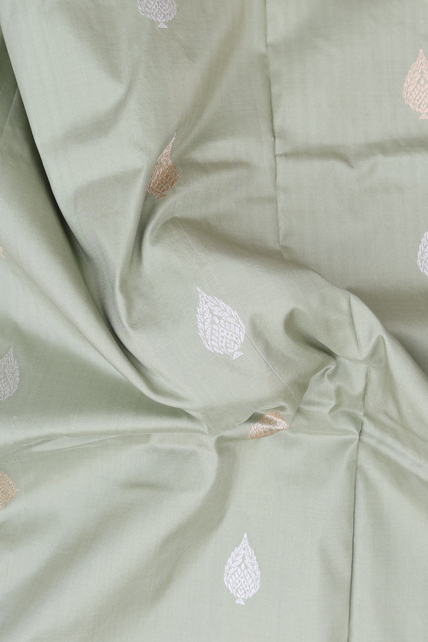 Banarasi Silk Saree In Pastel Green With Zari Buttas
