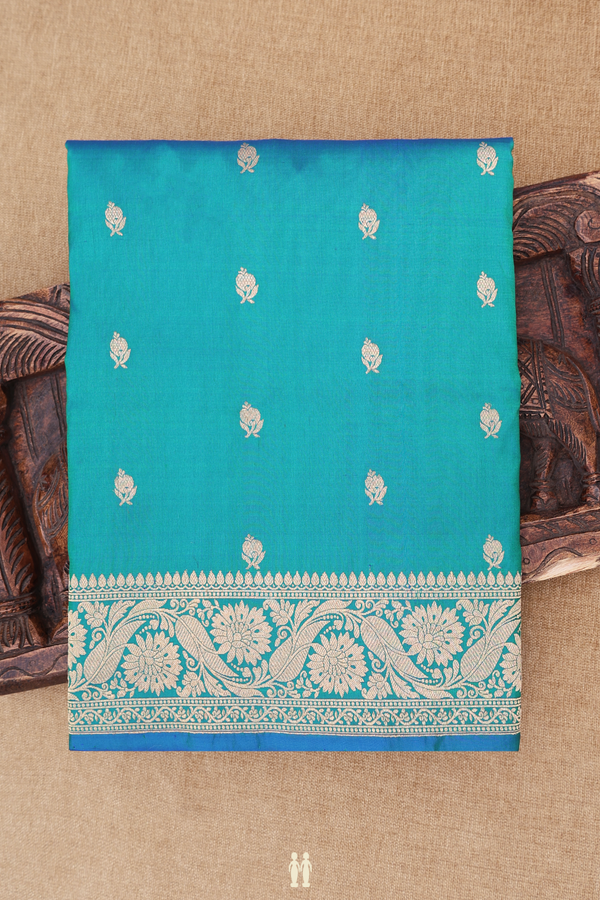 Banarasi Silk Saree In Peacock Blue With Floral Buttas