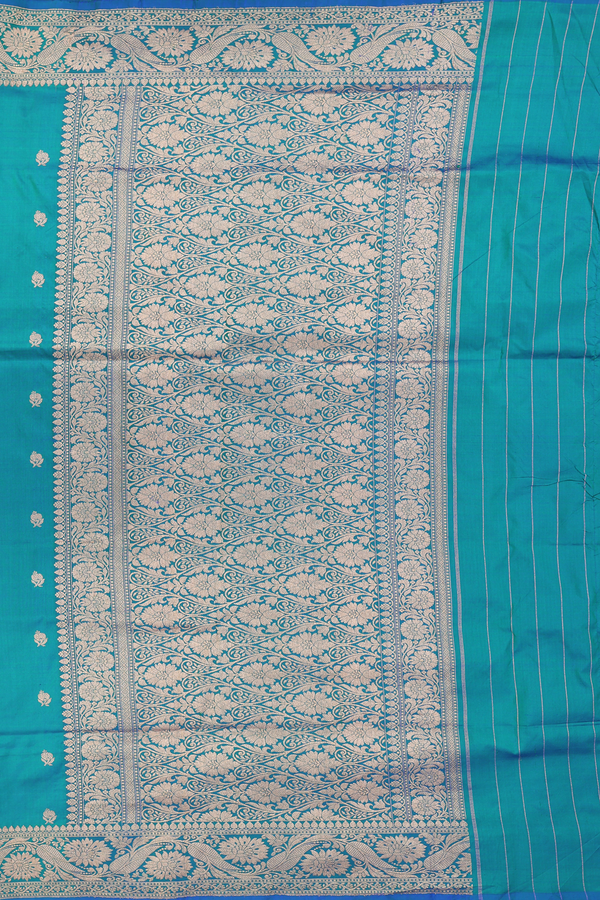 Banarasi Silk Saree In Peacock Blue With Floral Buttas