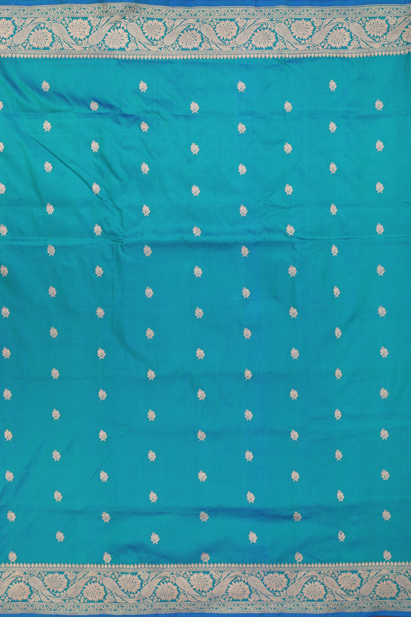 Banarasi Silk Saree In Peacock Blue With Floral Buttas