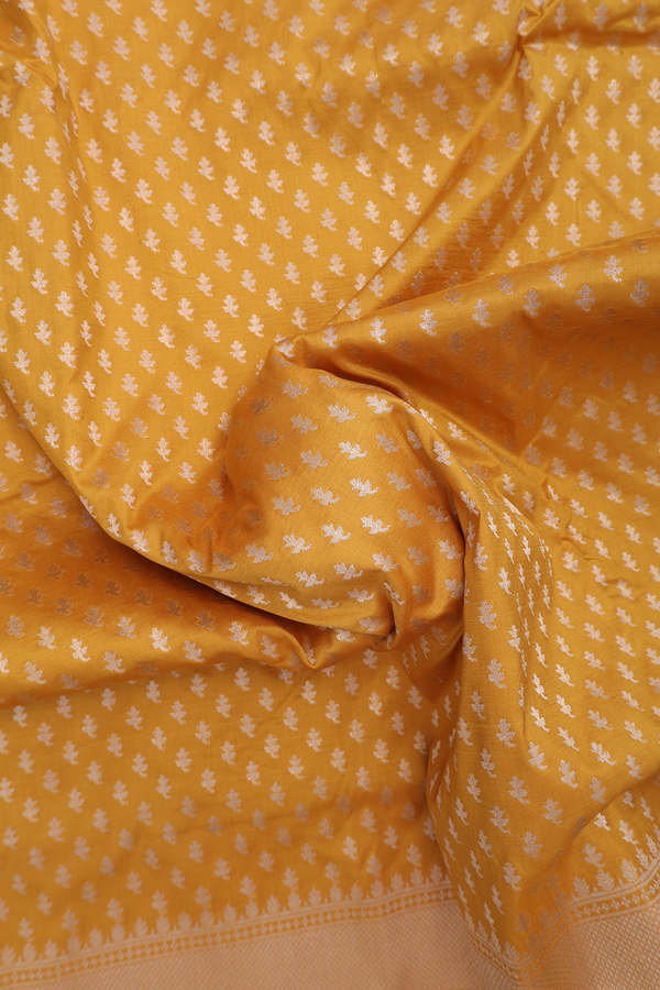 Banarasi Silk Saree In Saffron Yellow With Floral Buttis