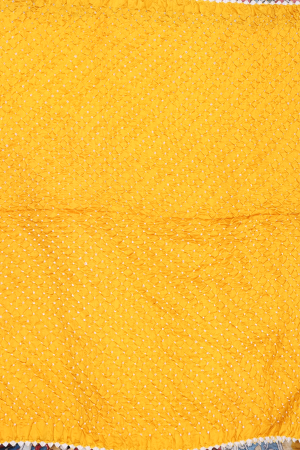 Bandhani Silk Saree In Saffron Yellow With Tie And Dye Design