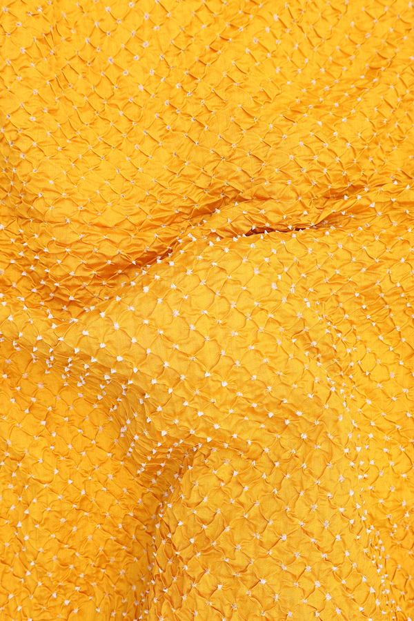 Bandhani Silk Saree In Saffron Yellow With Tie And Dye Design