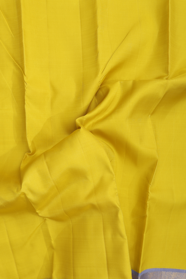 Kanchipuram Silk Saree In Plain Yellow With Korvai Border