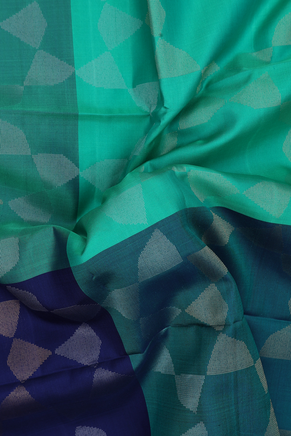 Soft Silk Saree In Blue And Green With Allover Design