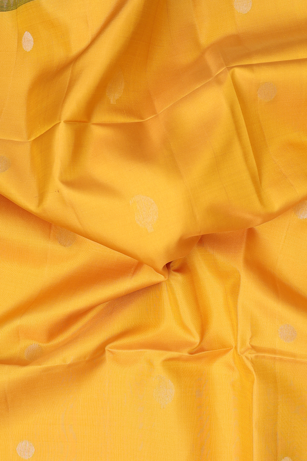 Soft Silk Saree In Saffron Yellow With Paisley Buttas