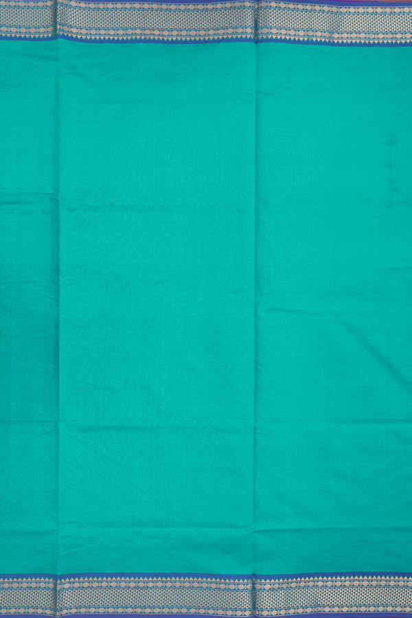 Semi Silk Cotton Saree In Peacock Blue With Zari Border